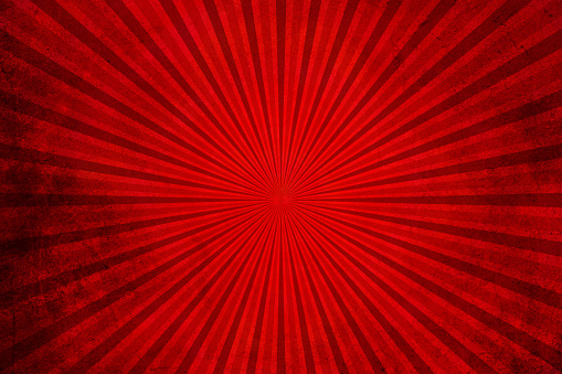 Red grunge background with sunburst. Red rays background