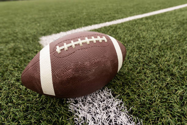 Football on the Field near the Fifty Football on the Field near the Fifty. High quality photo secondary school activities stock pictures, royalty-free photos & images