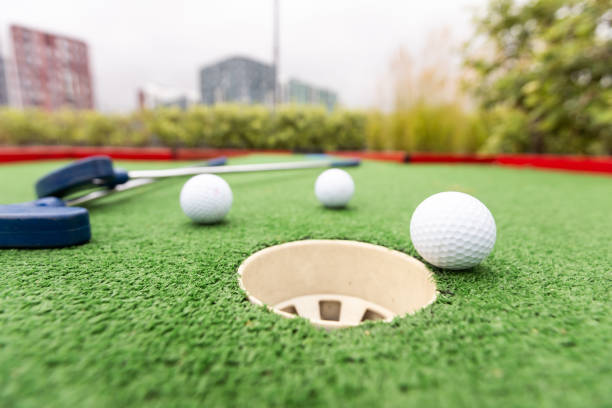 istock Golf stick and ball on green grass close up. 1929755132