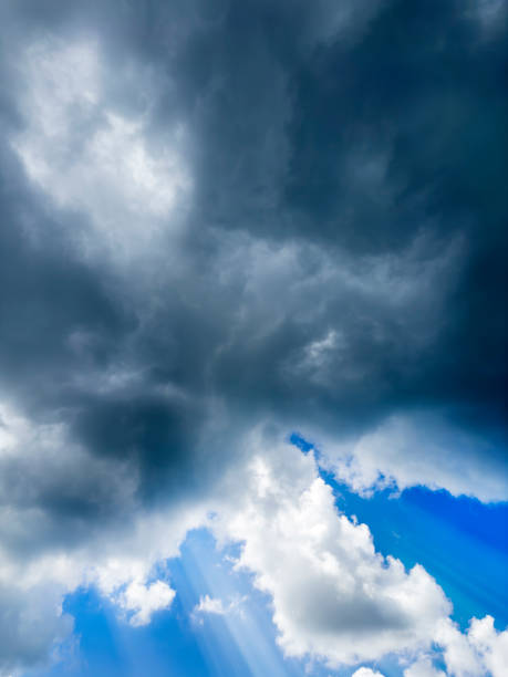 Empty Blue sky with gorgeous clouds and sun shining through