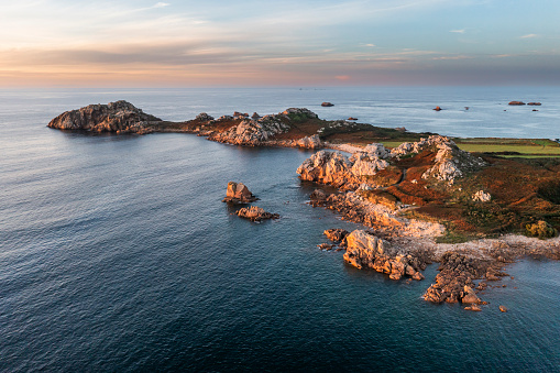 Drone view of Primel Tregastel, ocean coast in France, Brittany at sunset.