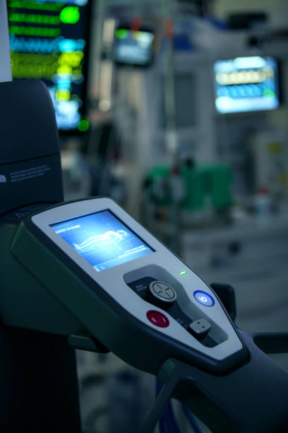 istock Surgical room with robot being operated by doctors for surgery performance 1929774217