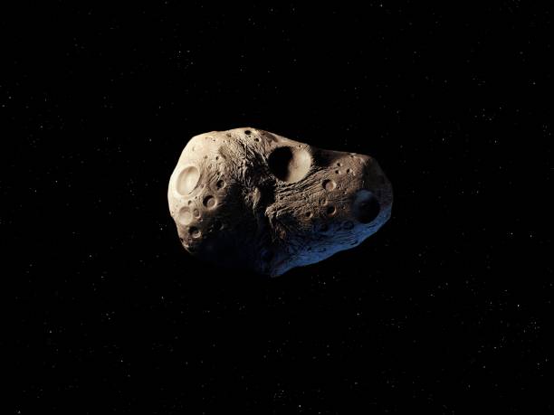 istock Asteroid in space isolated. Craters on the surface of a meteorite. 1929776855