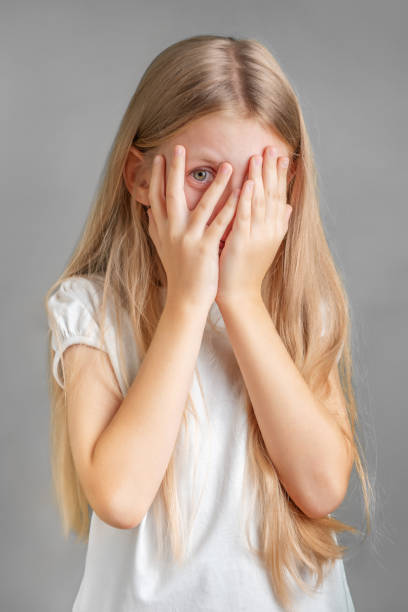 istock A little girl covering her face with her hands 1929791373