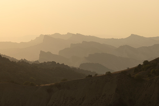 Georgian mountains in Vashlovani national park with semi-desert landscape of cliffs and dry sandstone ridge at sunset