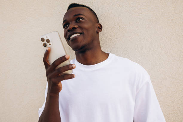 istock Young handsome man having conversation talking on the smartphone 1929834597