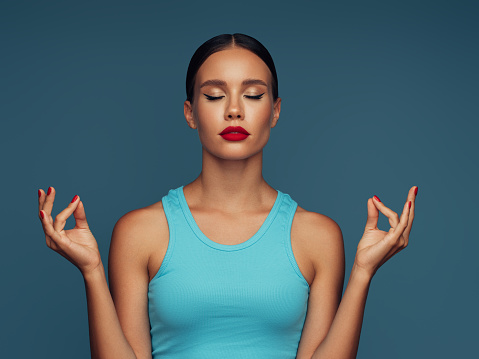 Young beautiful girl meditating