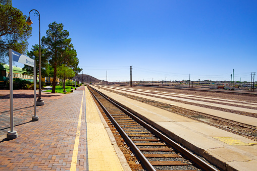 Barstow, California, United States - August 31, 2023: Tracks and sign of train station in Barstow, California