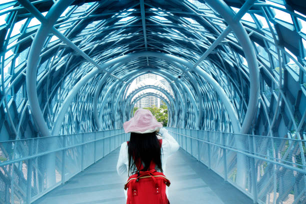 Woman in pedestrian walkway tunnel in Kuala Lumpur, Malaysia