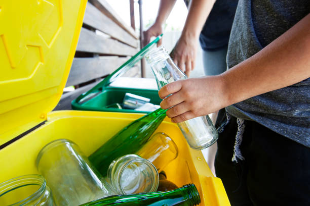 istock The mother is teaching her son how to sorting trash 1929866548