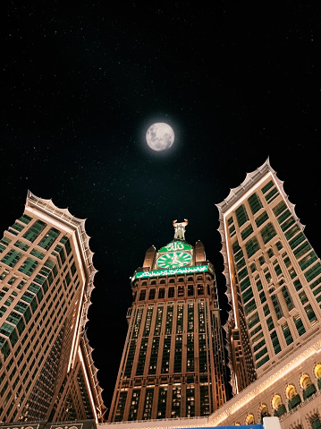 Clock tower Makkah, Saudi Arabia - Night view of the skyscrapers and the moon in the city