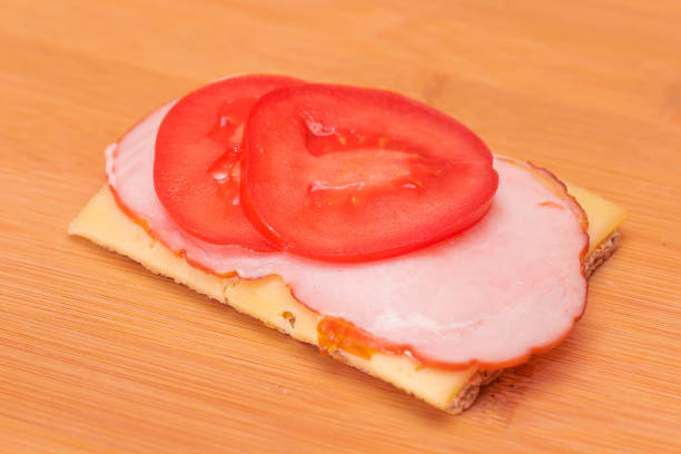 Close-Up Of Sandwich In Tray Against White Background