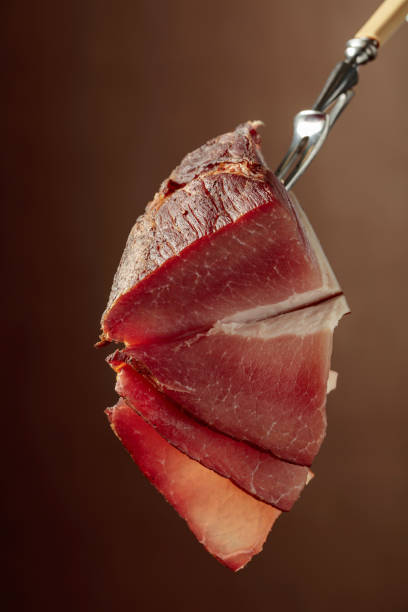 istock Dry-cured pork fillet on a fork. 1929879187
