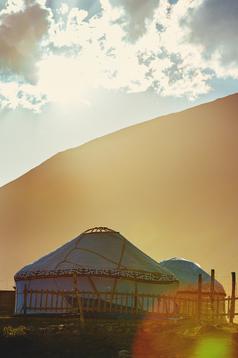 Nomadic yurts in the mountains at sunset, Kyrgyzstan