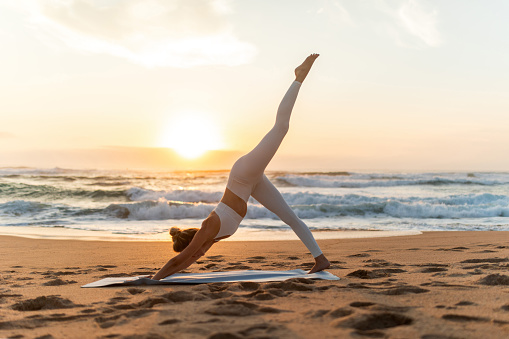 Beautiful woman doing yoga outdoor