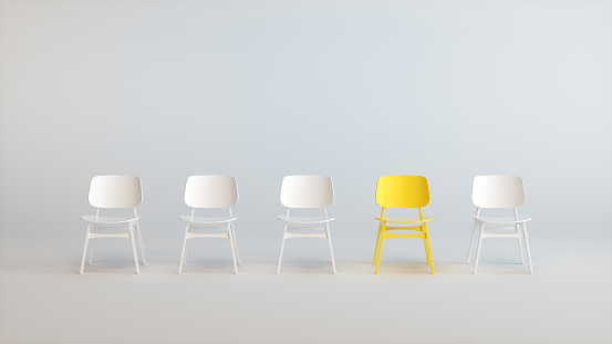 A Yellow Chair That Stands Out From the Chairs Crowd on a Soft White Studio Background. Business concept. 3D rendering