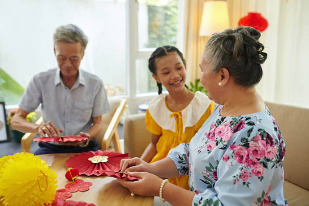 istock Family Gluing Paper Decorations 1929889410