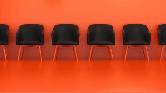 A Row of Black Chairs Along the Wall Against a Red Studio Background. Business concept. 3D rendering.