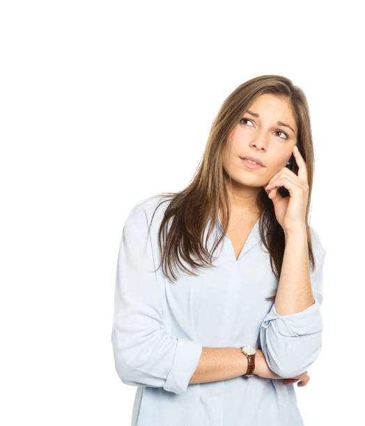 istock Beautiful young woman thinking deeply as she looks up into space for your copy 1929891539