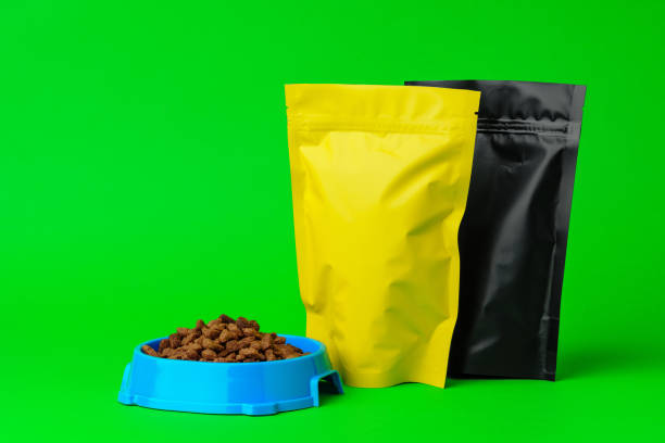 istock Cat food on green background in studio 1929894435