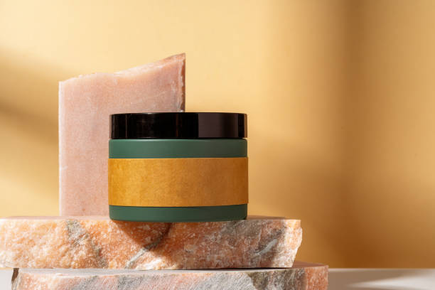 istock Cosmetic product jar in composition with granite stones and shadow 1929894450