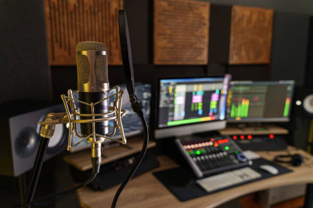 istock Professional microphone in a small music sound production studio workstation 1929895544