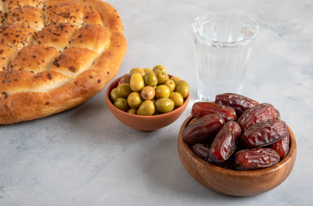 istock Traditional iftar table with dates, pita, and green olives 1929898953