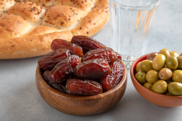 istock Traditional iftar table with dates, pita, green olives 1929898986