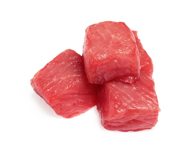 istock Pieces of raw beef isolated on white 1929918319