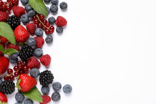 istock Many different fresh berries and mint leaves on white background, flat lay. Space for text 1929925046