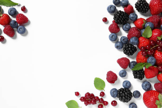 istock Many different fresh berries and mint leaves on white background, flat lay. Space for text 1929925576