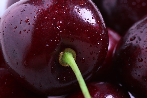 Ripe cherries with water drops as background, macro view. Fresh berry