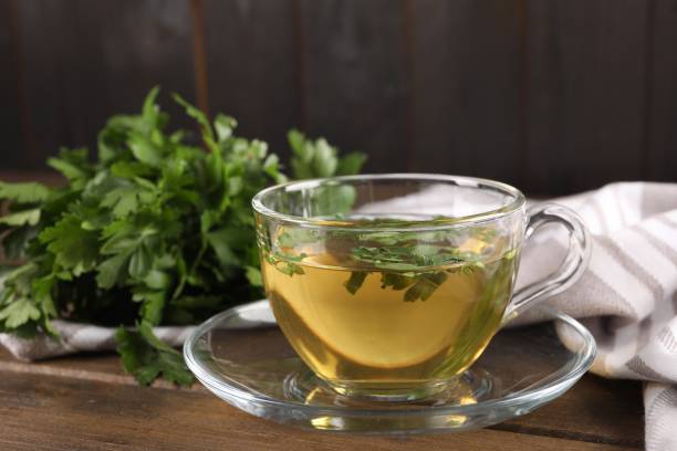 istock Aromatic herbal tea with parsley on wooden table, closeup 1929932206