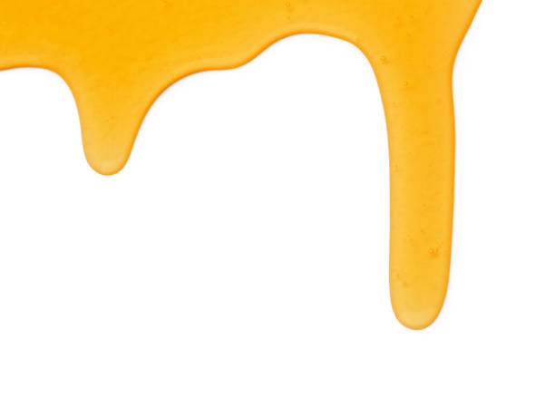istock Tasty natural honey drips isolated on white, top view 1929937737