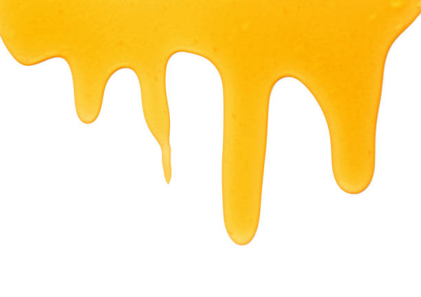 istock Tasty natural honey drips isolated on white, top view 1929938814