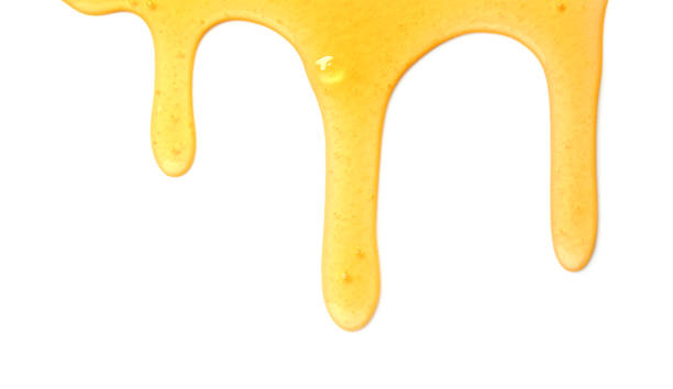 istock Tasty natural honey drips isolated on white, top view 1929939981