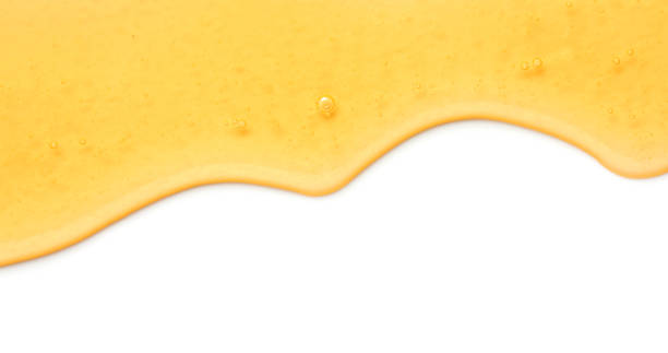 istock Tasty natural honey flowing isolated on white, top view 1929939983