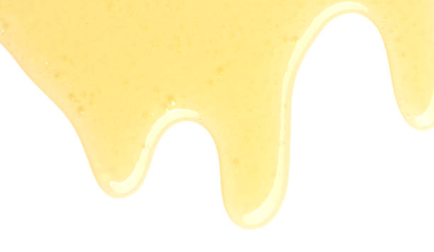 istock Tasty natural honey drips isolated on white, top view 1929940488