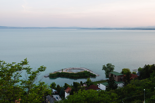 Overview from a viewpoint over Lake Balaton with a forest and Morr area in the foreground