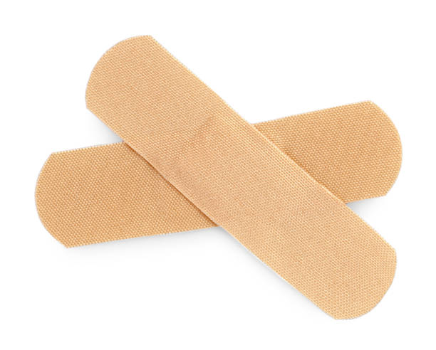 istock Medical adhesive bandages isolated on white, top view 1929960045