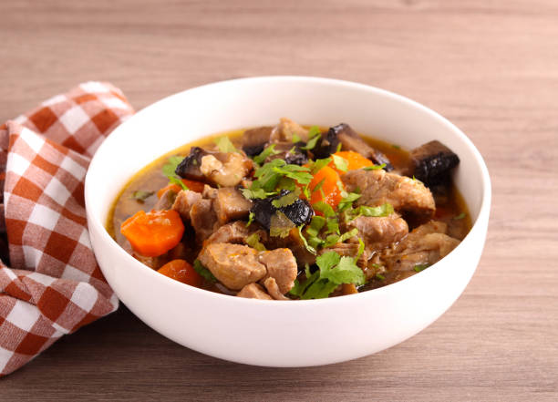 istock Meat and mushroom stew with carrot 1929960646