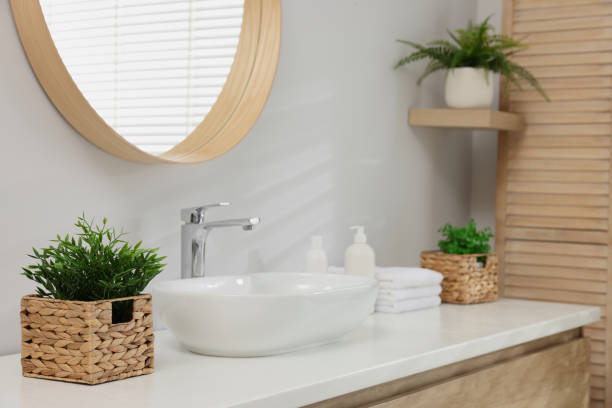 istock Different potted artificial plants in bathroom. Home decor 1929961347