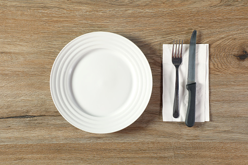 Single empty plate on table