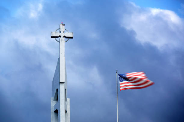 istock American flag and church rooftop with cross over dramatic sky 1929965235