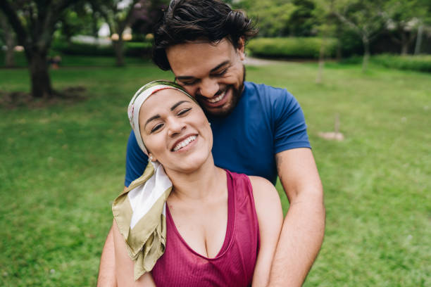 istock Couple embracing at park 1929965582
