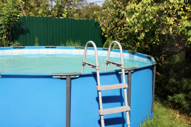istock Above ground swimming pool on grass in backyard 1929969227