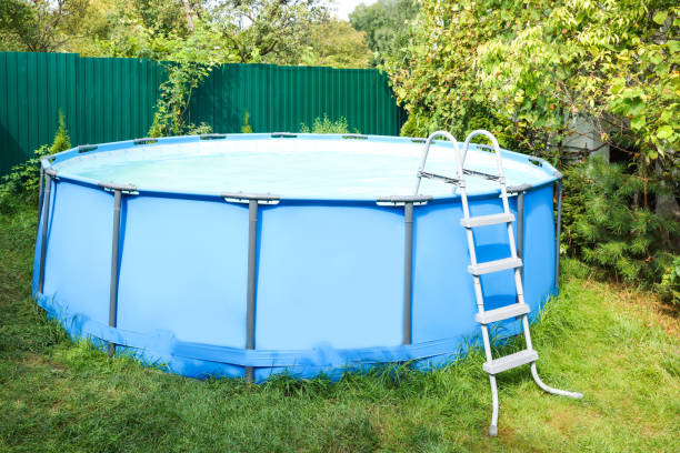 istock Above ground swimming pool on grass in backyard 1929969792