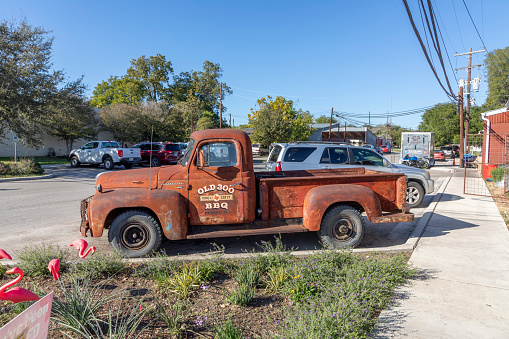 Blanco, Texas - November 2, 2023: old rusty collectors car at the street in Blanco, Texas.