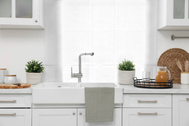 istock Different potted artificial plants on countertop in kitchen. Home decor 1929976502