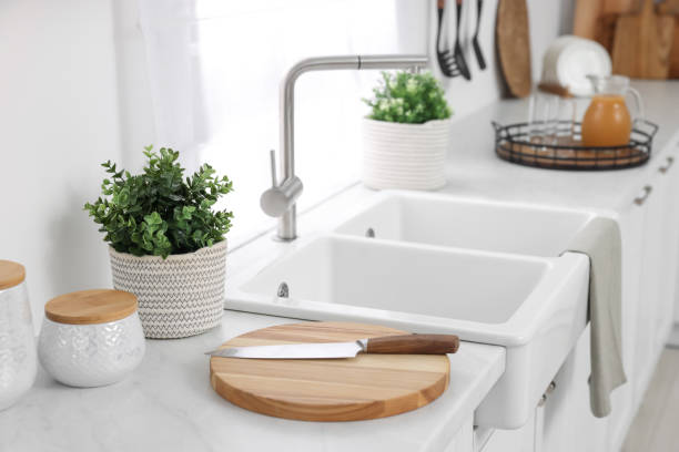 istock Different potted artificial plants on countertop in kitchen. Home decor 1929977083